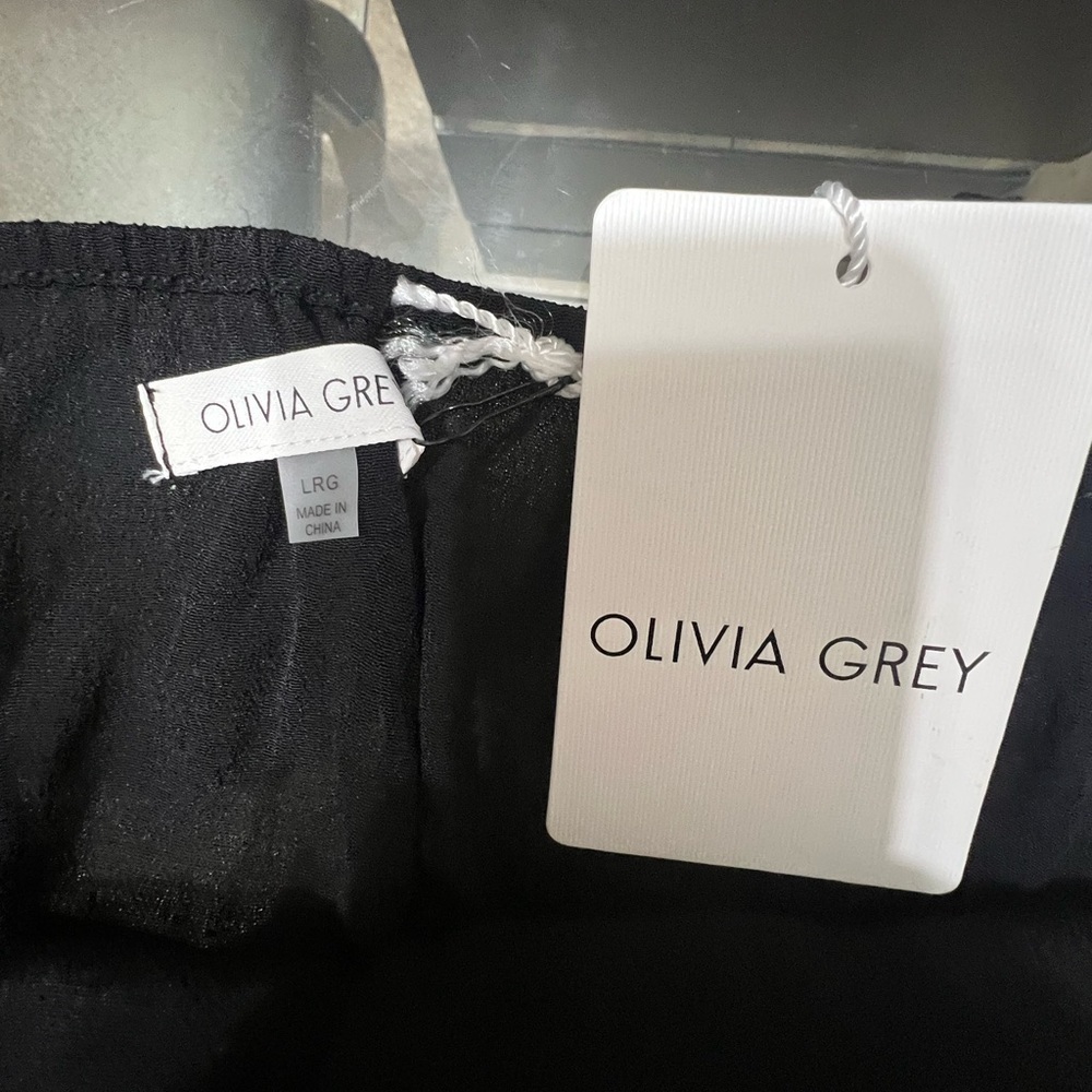 OLIVA GREY Elegant Black Wide-Leg Pants
Caja 9 - Picture 4 of 4